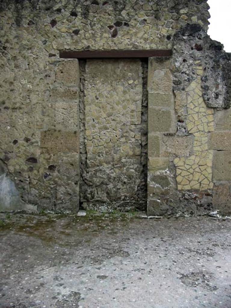 VI.13/11, Herculaneum. May 2003. Atrium, doorway in east wall in north-east corner.
The blocked doorway would have led into the rear room of VI.12. Photo courtesy of Nicolas Monteix.